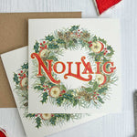Irish Wreath Christmas-themed card with watercolour painted decorative elements on a white surface